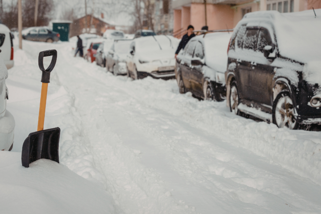 Snow-covered vehicles parked during a Minnesota extreme cold winter