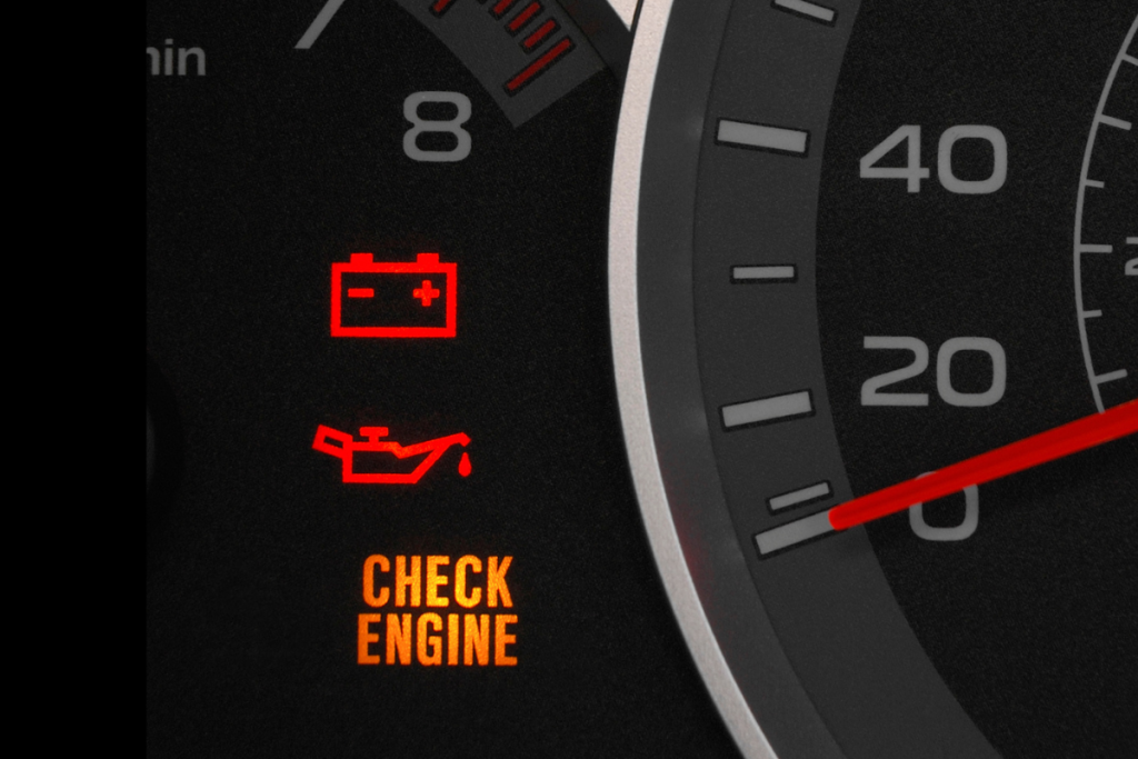 red dashboard warning light illuminated on vehicle instrument panel